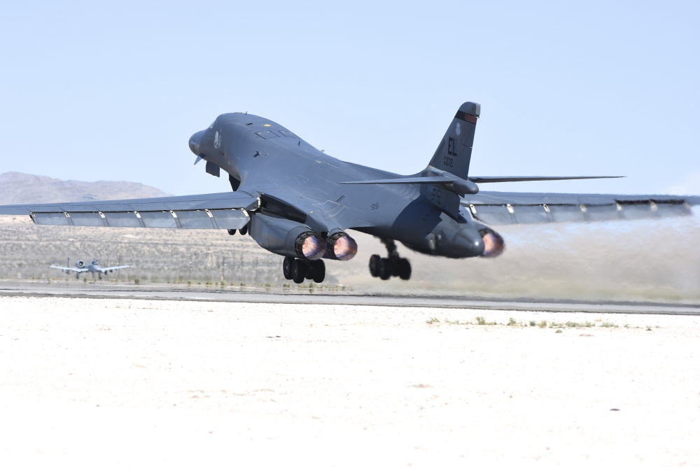 A B-1B Lancer from 28th Bomb Wing taking off from Nellis Air Force Base Nevada Canvas Art - Riccardo NiccoliStocktrek Images (17 x 12)