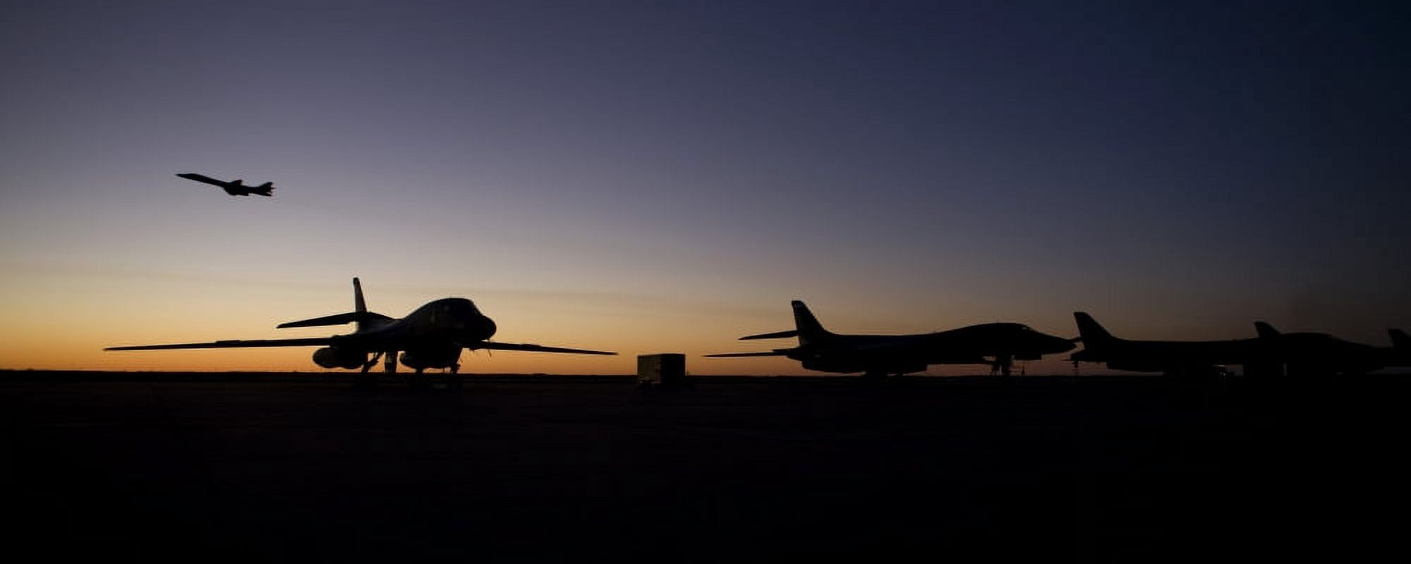 A B-1B Lancer takes off at sunset from Dyess Air Force Base Texas Canvas Art - HIGH-G ProductionsStocktrek Images (44 x 18)