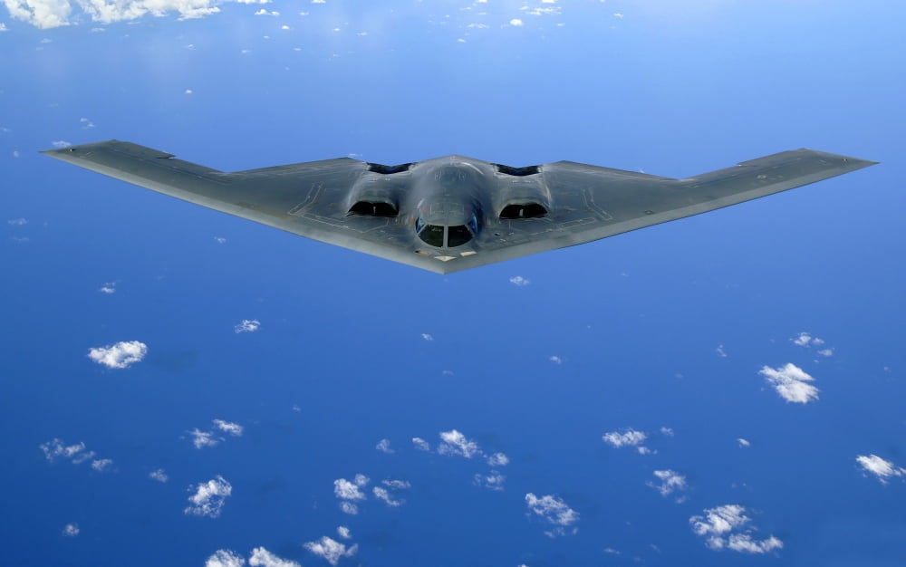 A B-2 Spirit soars through the sky after a refueling mission Canvas Art - Stocktrek Images (36 x 22)