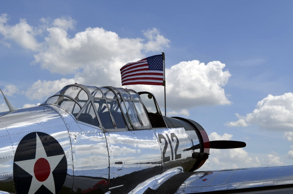 A BT-13 Valiant trainer aircraft with American Flag Canvas Art - Stocktrek Images (35 x 23)