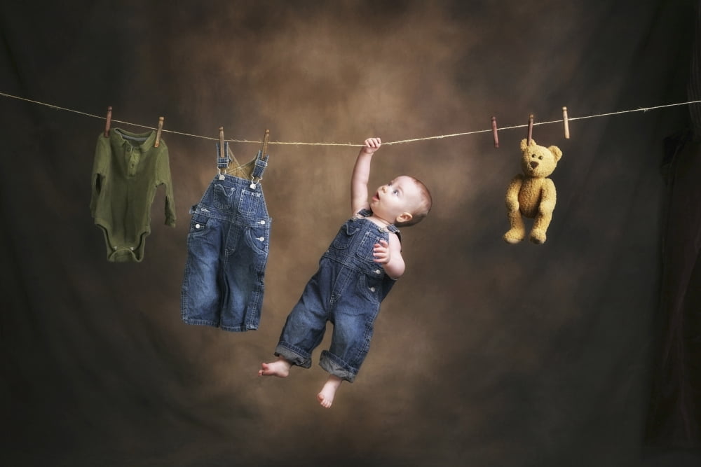 A Baby On The Clothesline Canvas Art - Pete Stec Design Pics (19 x 12)