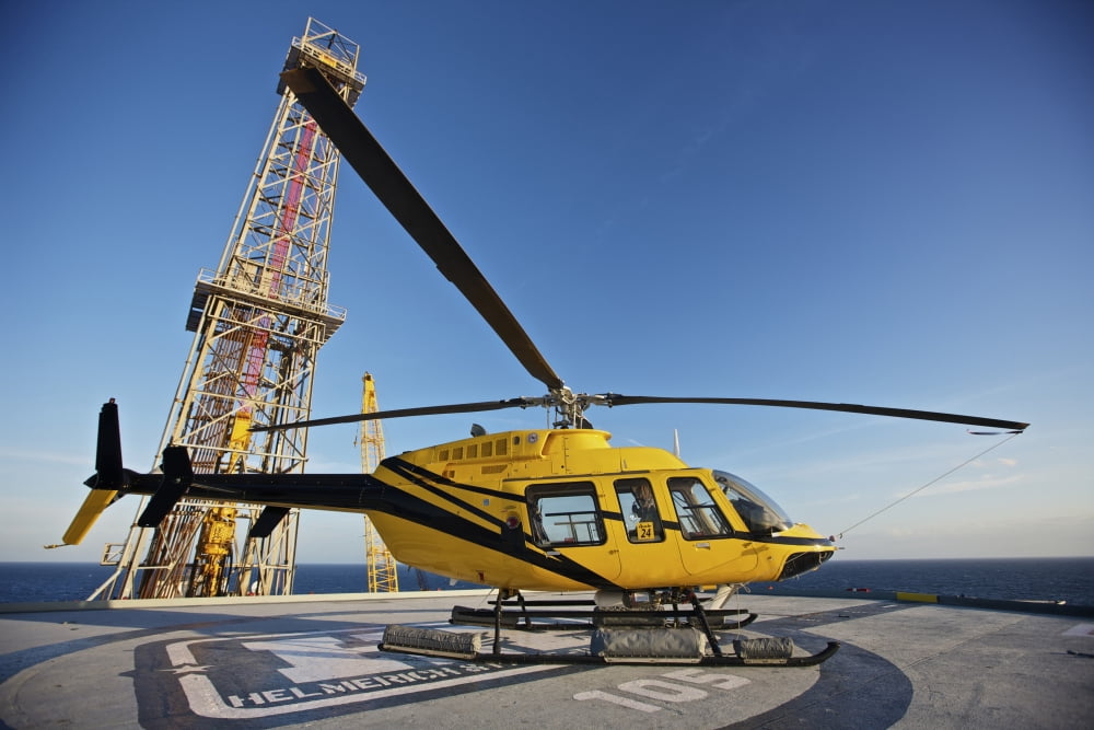 A Bell 407 utility helicopter on the helipad of an oil rig Canvas Art - Terry MooreStocktrek Images (18 x 12)