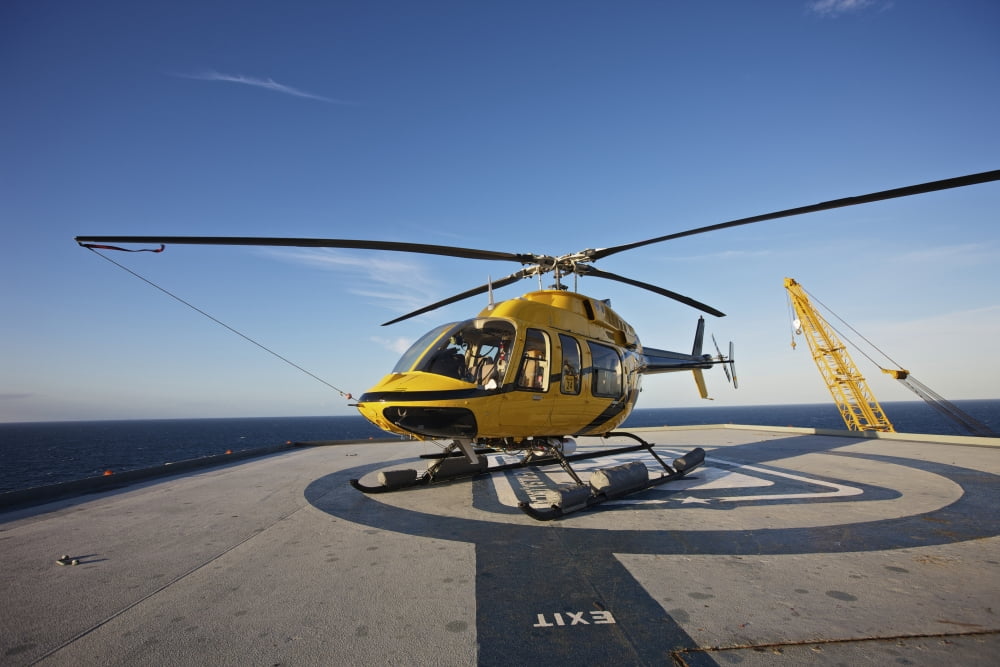A Bell 407 utility helicopter on the helipad of an oil rig Canvas Art - Terry MooreStocktrek Images (18 x 12)