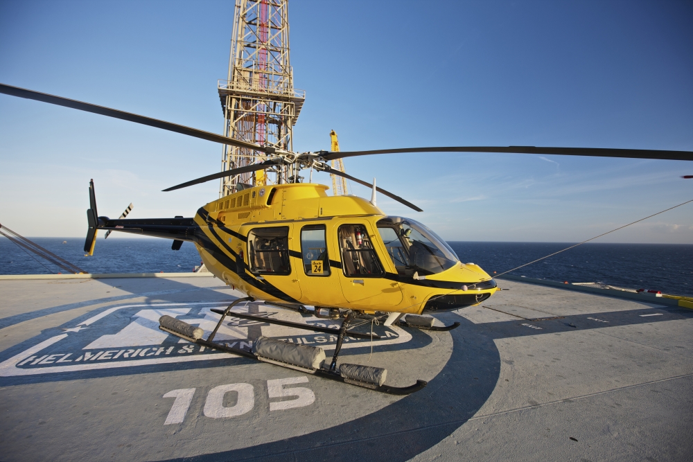 A Bell 407 utility helicopter on the helipad of an oil rig Canvas Art - Terry MooreStocktrek Images (18 x 12)