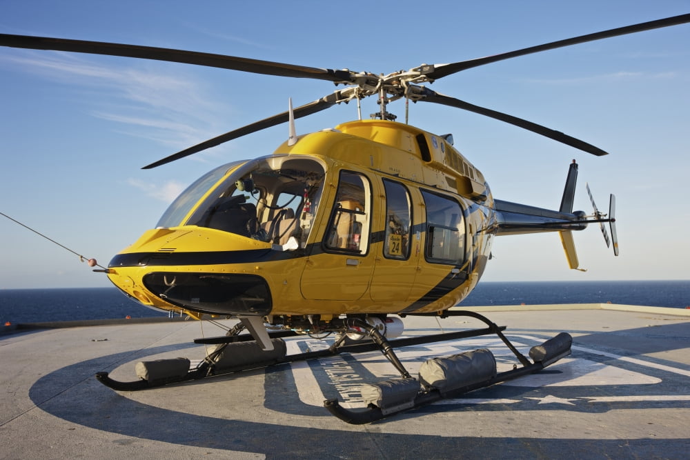 A Bell 407 utility helicopter on the helipad of an oil rig Canvas Art - Terry MooreStocktrek Images (35 x 24)