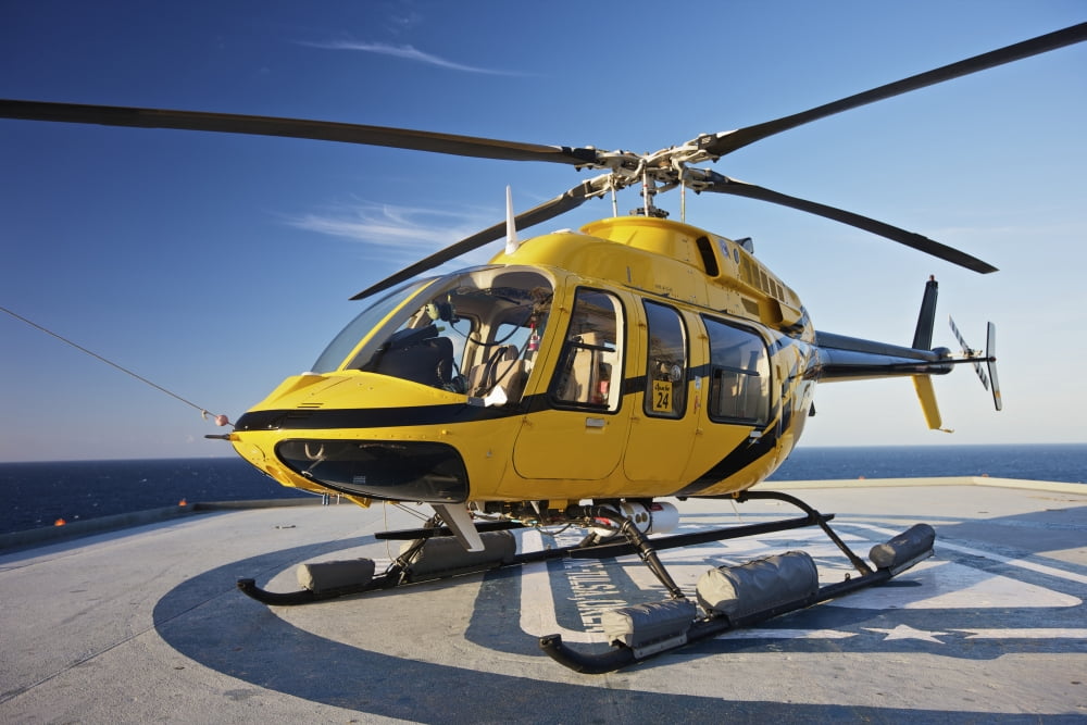 A Bell 407 utility helicopter on the helipad of an oil rig Canvas Art - Terry MooreStocktrek Images (35 x 24)