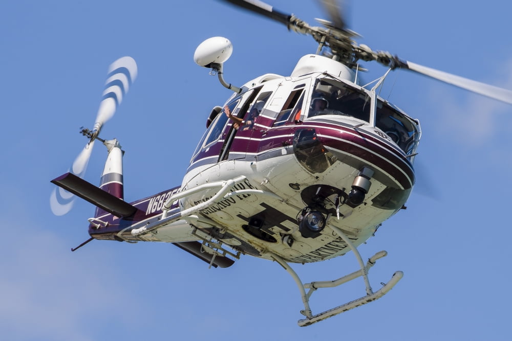 A Bell 412 helicopter flies along the Chicago lakefront Canvas Art - Rob EdgcumbeStocktrek Images (17 x 12)