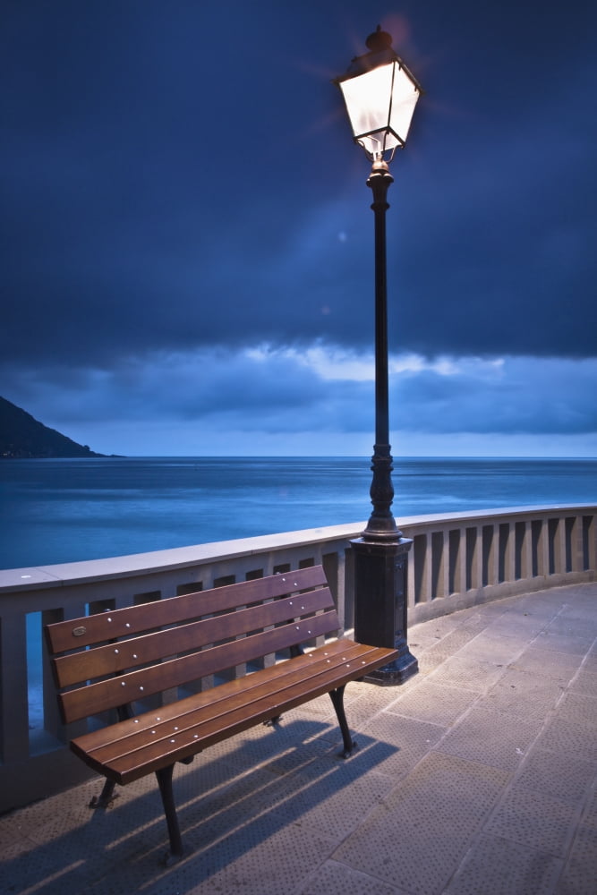 A Bench And Light Post Along The Railing On The Coast Camogli Liguria Italy Canvas Art - David DuChemin Design Pics (12 x 19)