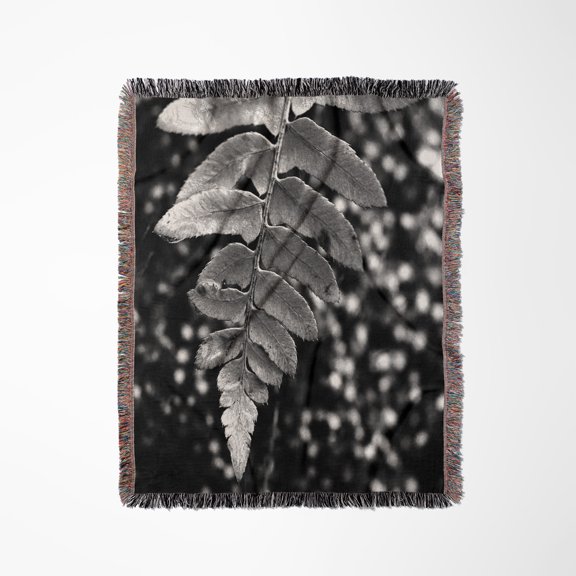 A Black And White Macro Photograph Of A Fern Leaf Hanging Over Moss., Woven Blanket