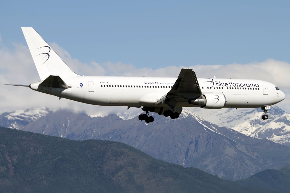 A Boeing 767 of Blue Panorama Airlines flying over Italy Canvas Art - Luca NicolottiStocktrek Images (18 x 12)
