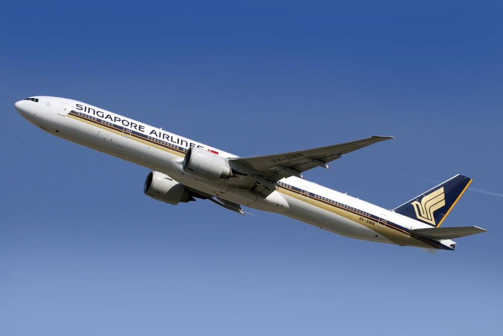A Boeing 777 of Singapore Airlines in flight over Italy Canvas Art - Luca NicolottiStocktrek Images (35 x 23)
