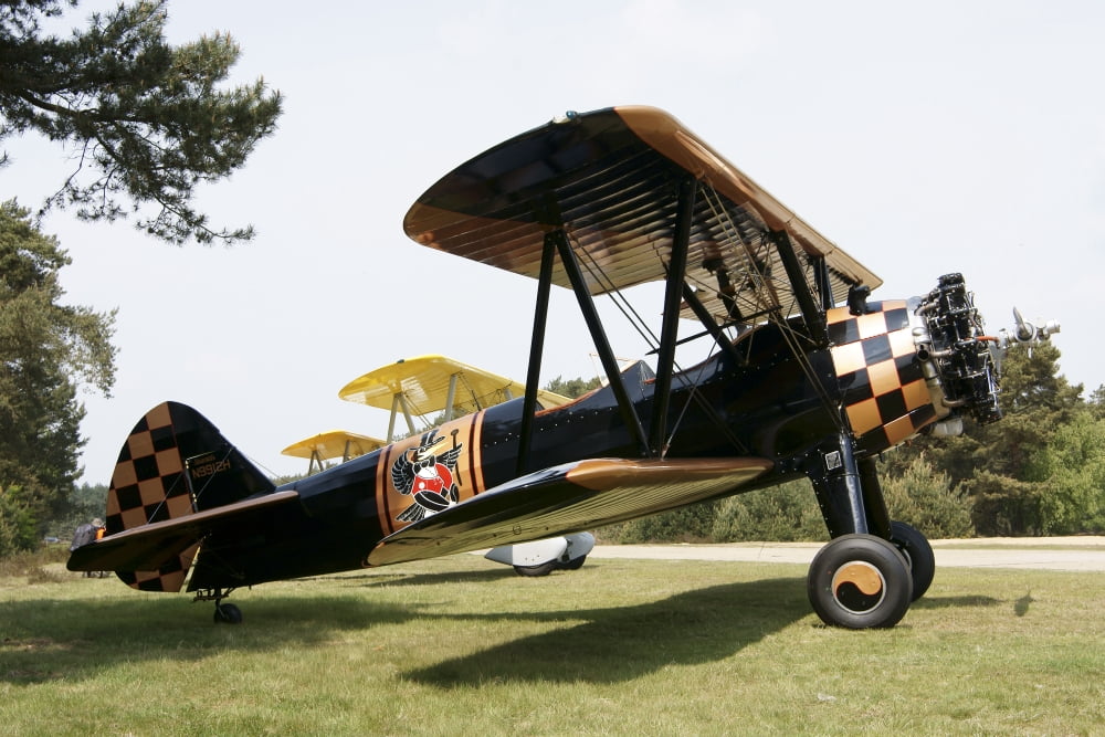 A Boeing Stearman N2S-3 model biplane Canvas Art - Ramon Van OpdorpStocktrek Images (35 x 23)
