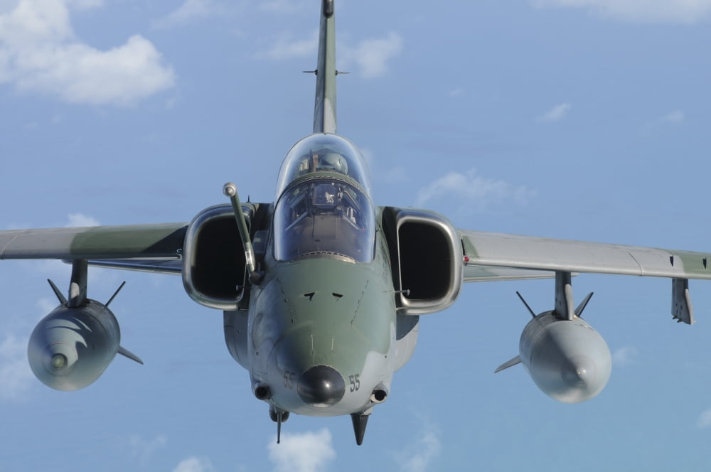 A Brazilian Air Force AMX-T (A-1B) fighter-bomber in flight Canvas Art - Riccardo NiccoliStocktrek Images (18 x 12)