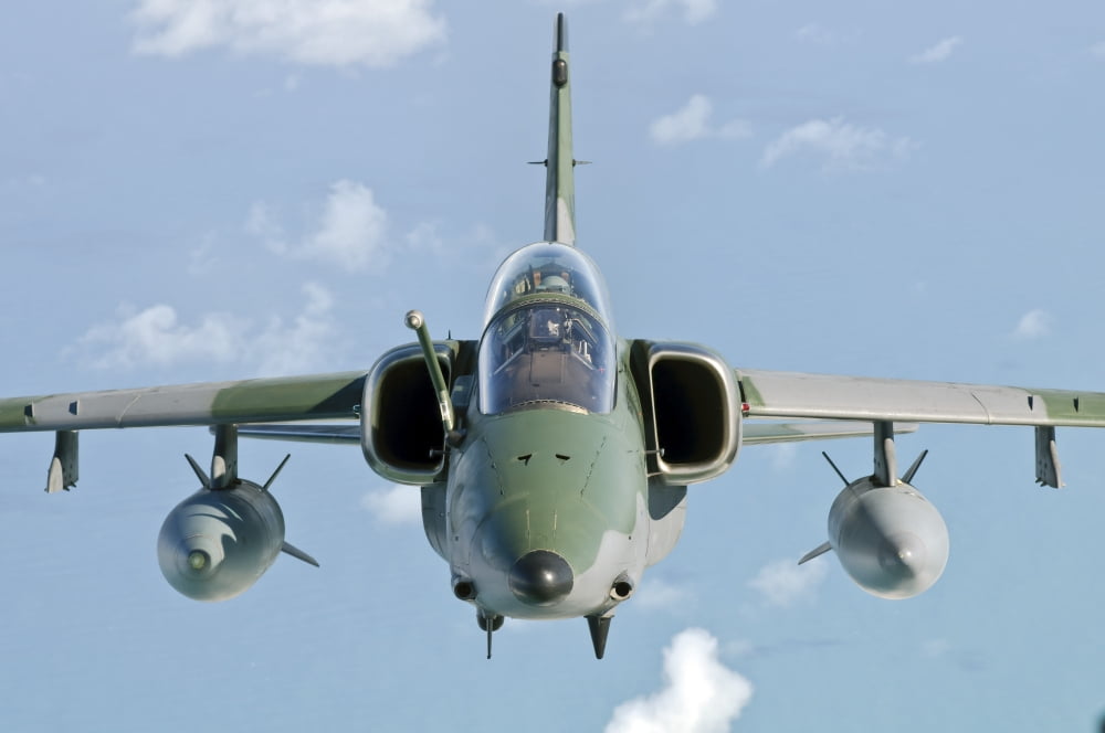 A Brazilian Air Force Embraer A-1B soars through the sky over Brazil Canvas Art - Giovanni CollaStocktrek Images (35 x 23)