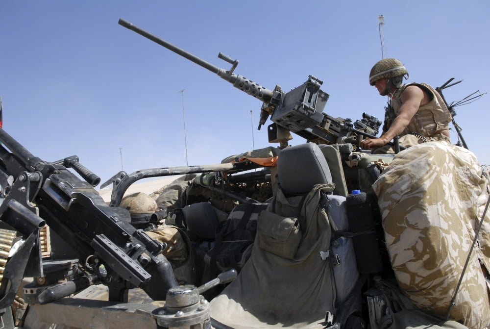 A British Army soldier mans the mounted machine gun on a land rover Canvas Art - Andrew ChittockStocktrek Images (34 x 23)