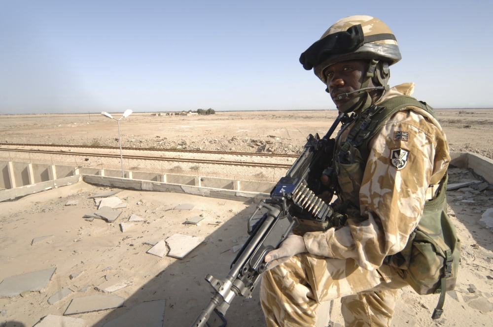A British Army soldier provides security in Basra Iraq Canvas Art - Andrew ChittockStocktrek Images (34 x 23)