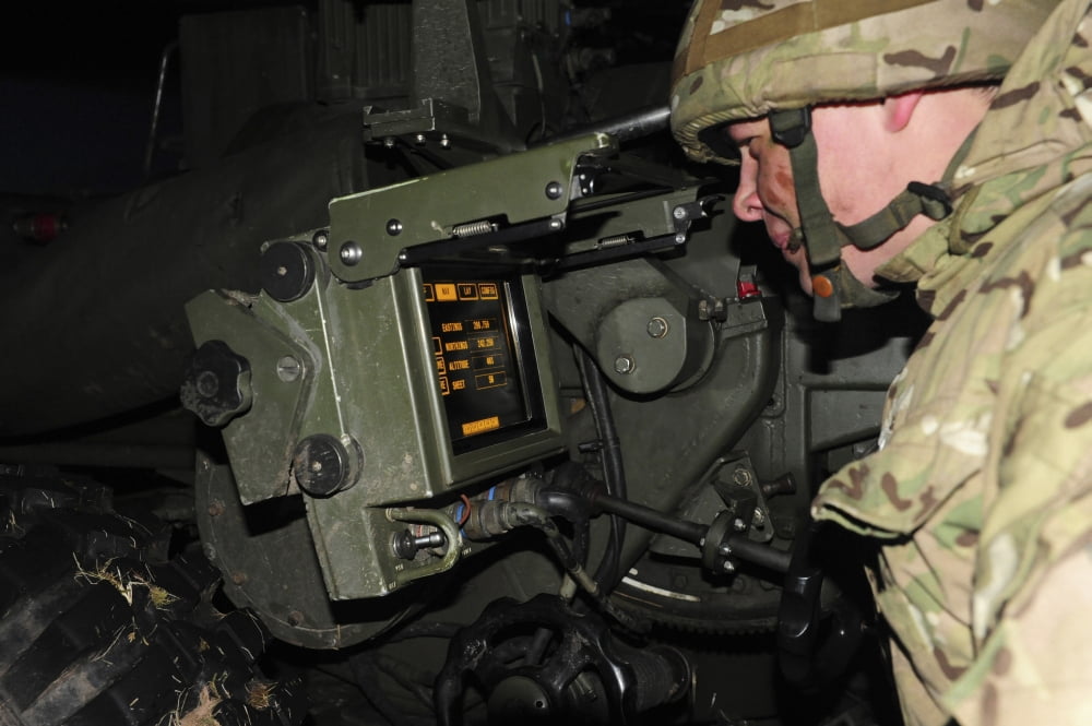 A British gunner checks the firing data on the L118 Light Gun Canvas Art - Andrew ChittockStocktrek Images (35 x 23)