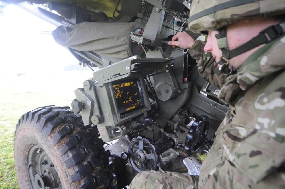 A British gunner checks the firing data on the L118 Light Gun Canvas Art - Andrew ChittockStocktrek Images (35 x 24)