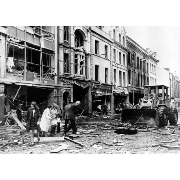 A Bulldozer Clears Away Debris In A Devestated Shopping Area Following The Explosion Of A 250-Pound Bomb History (