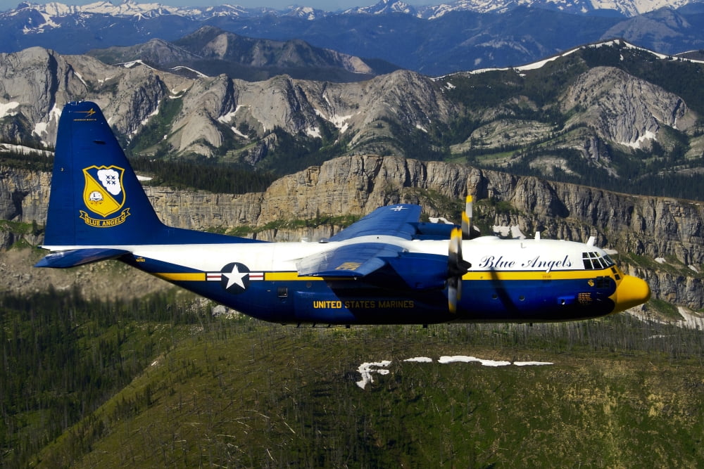 A C-130 Hercules Fat Albert plane flies over the Chinese Wall rock formation in Montana Canvas Art - Stocktrek Images (34 x 23)