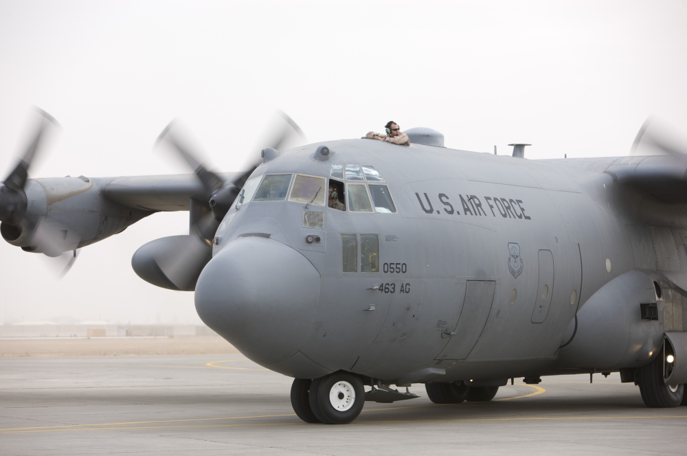 A C-130 Hercules aircraft taxis on the tarmac Canvas Art - Terry MooreStocktrek Images (18 x 12)