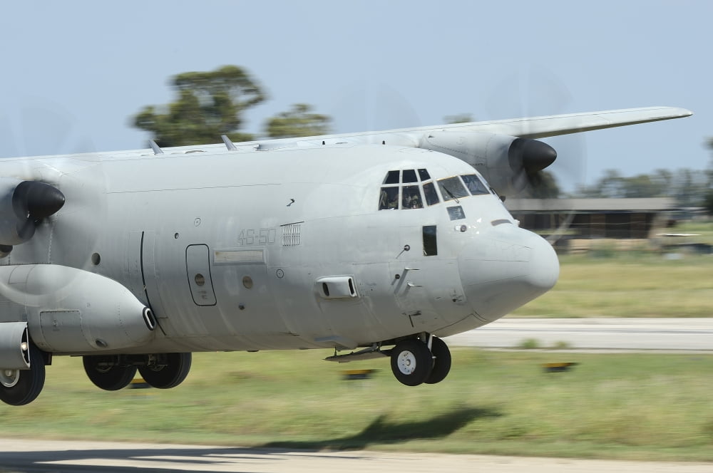 A C-130 Hercules of the Italian Air Force performs a touch and go landing Canvas Art - Remo GuidiStocktrek Images (18 x 12)