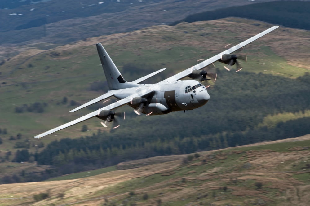 A C-130 Hercules of the Royal Air Force flying over North Wales Canvas Art - Andrew ChittockStocktrek Images (18 x 12)