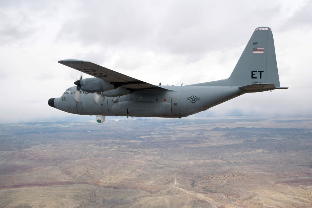 A C-130 Hercules soars through the sky Canvas Art - Stocktrek Images (34 x 23)