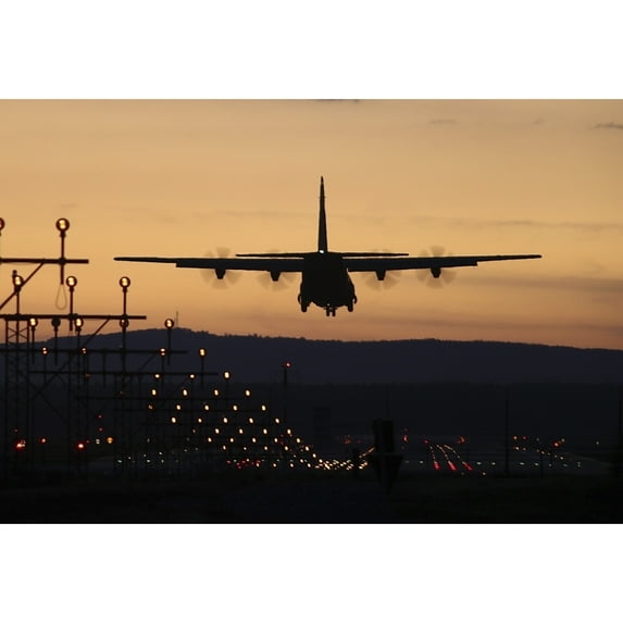 A C-130J Super Hercules landing at Ramstein Air Base Germany at dusk Poster Print