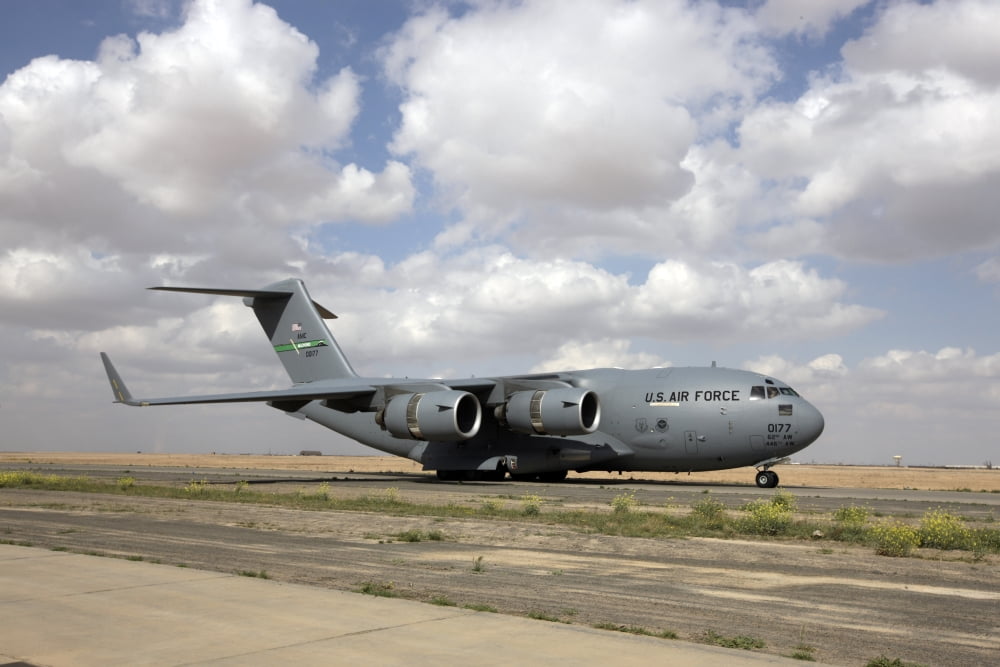 A C-17 Globemaster III on the runway Canvas Art - Terry MooreStocktrek Images (18 x 12)