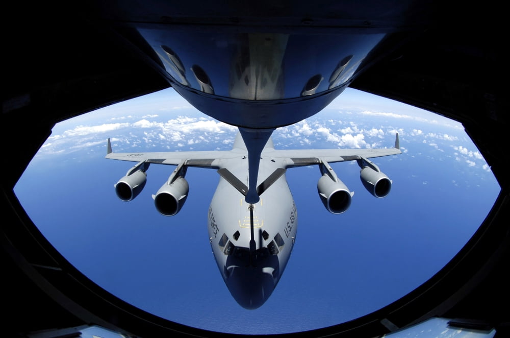 A C-17 Globemaster III receives fuel from a KC-135 Stratotanker Canvas Art - Stocktrek Images (34 x 23)