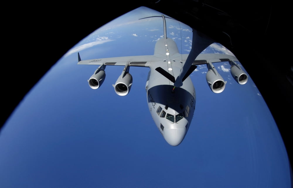 A C-17 Globemaster III receives fuel from a KC-135 Stratotanker Canvas Art - Stocktrek Images (35 x 22)