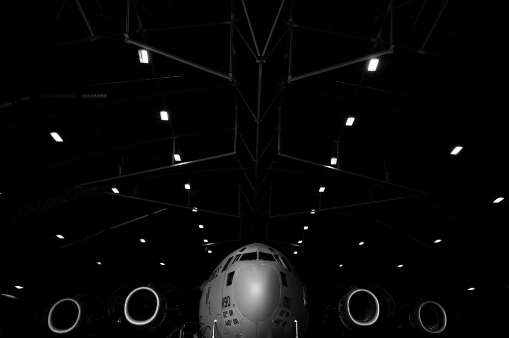 A C-17 Globemaster III sits in a hangar at McChord Field Air Force Base Washington Canvas Art - Stocktrek Images (34 x 23)