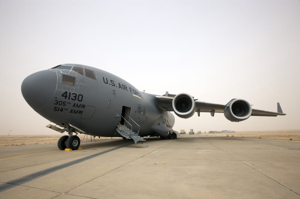 A C-17 Globemaster III sits on the runway at COB Speicher Iraq Canvas Art - Terry MooreStocktrek Images (18 x 12)