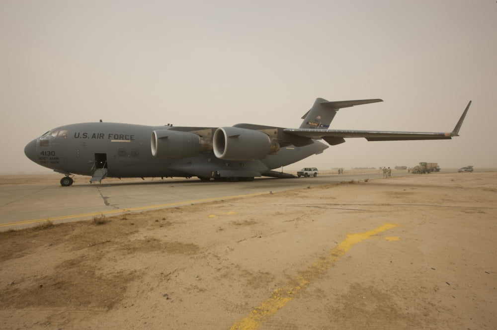 A C-17 Globemaster III sits on the runway at COB Speicher Iraq Canvas Art - Terry MooreStocktrek Images (18 x 12)