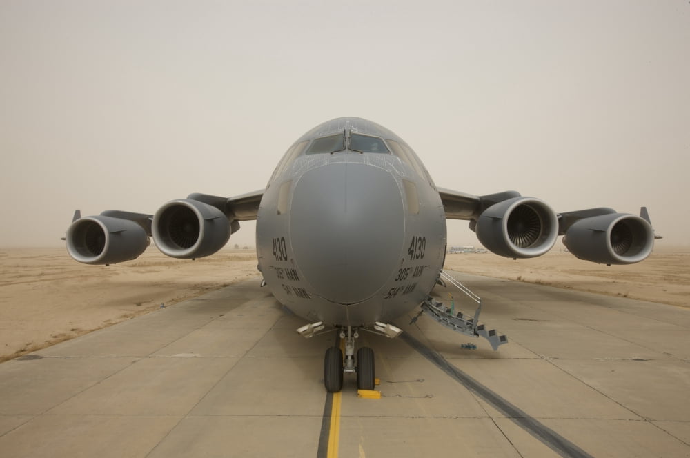 A C-17 Globemaster III sits on the runway at COB Speicher Iraq Canvas Art - Terry MooreStocktrek Images (35 x 23)