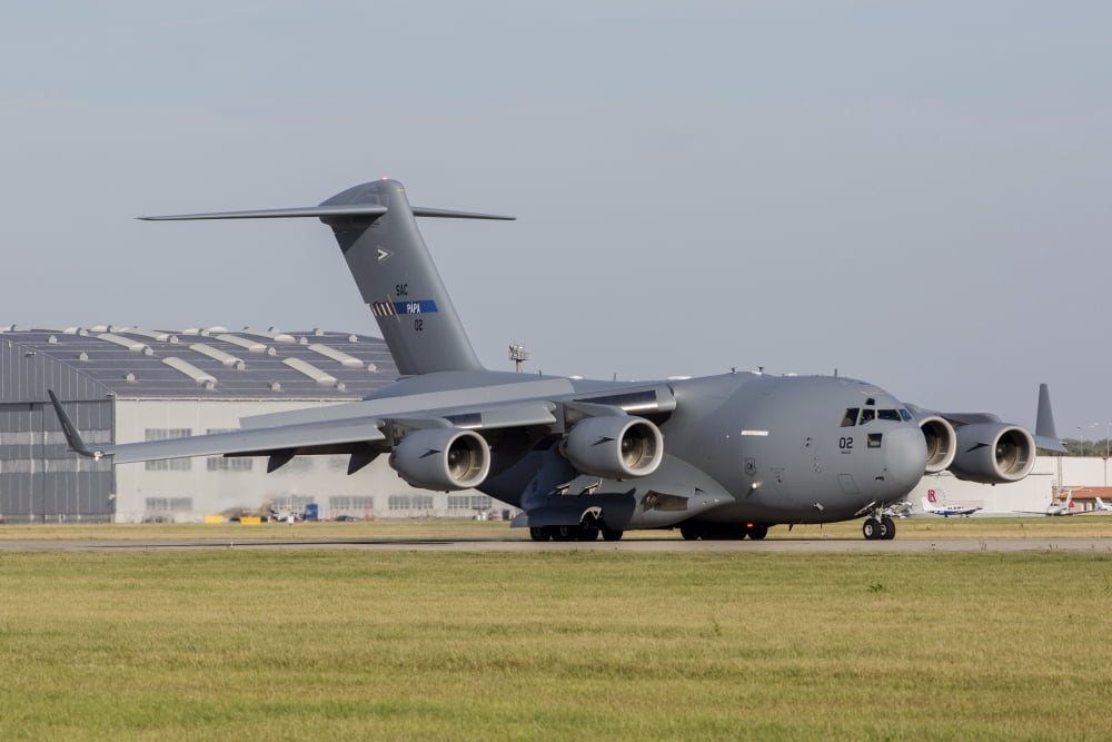 A C-17 Globemaster strategic transport aircraft taxiing on the runway Canvas Art - Timm ZiegenthalerStocktrek Images (17 x 12)