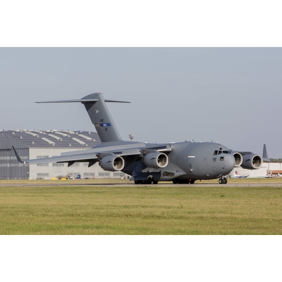 A C-17 Globemaster strategic transport aircraft taxiing on the runway Canvas Art - Timm ZiegenthalerStocktrek Images (17 x 12)