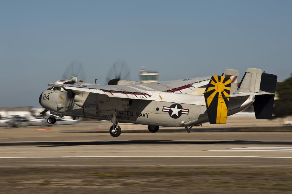 A C-2 Greyhound lands on Naval Air Station North Island Canvas Art - Stocktrek Images (35 x 23)