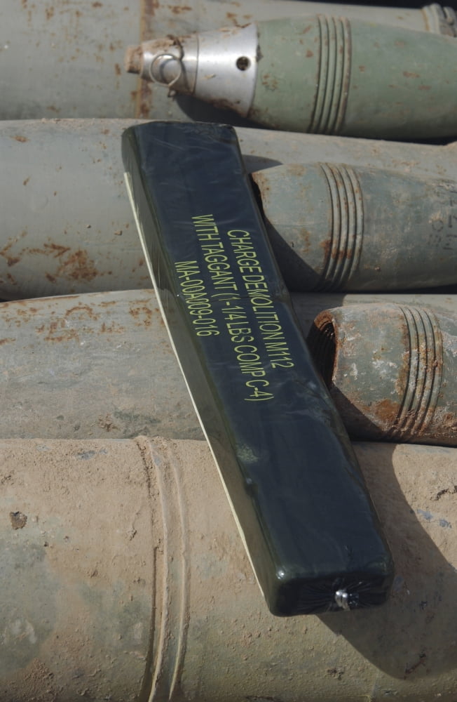 A C-4 explosive placed on a 100 millimeter armor piercing round Canvas Art - Stocktrek Images (23 x 34)