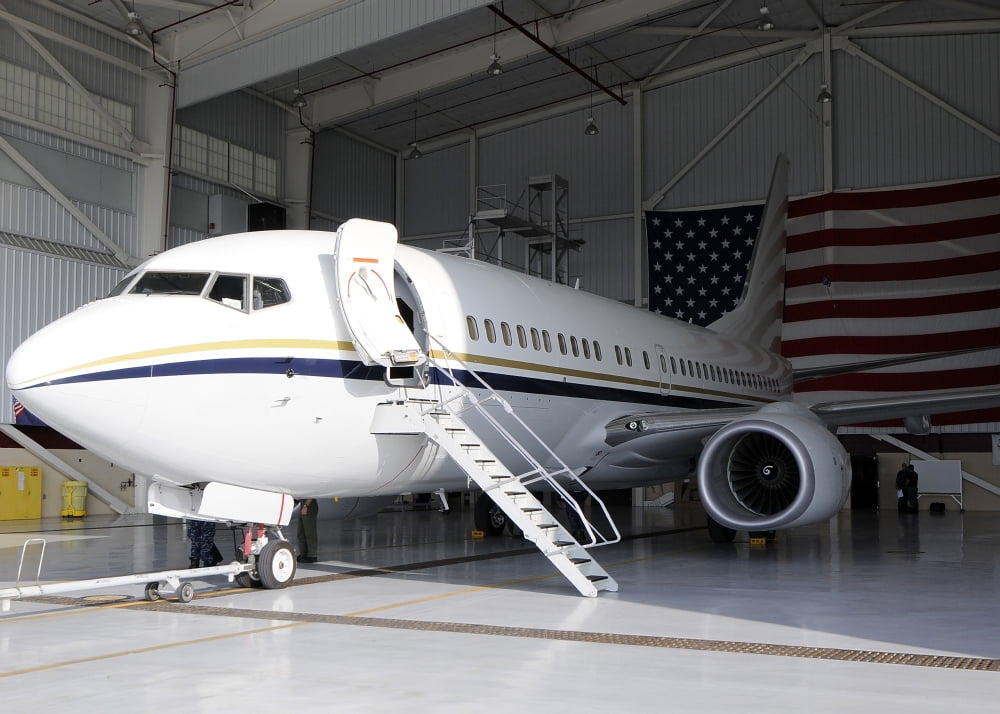 A C-40 Clipper in a hangar after arriving at Naval Air Station North Island Canvas Art - Stocktrek Images (34 x 24)