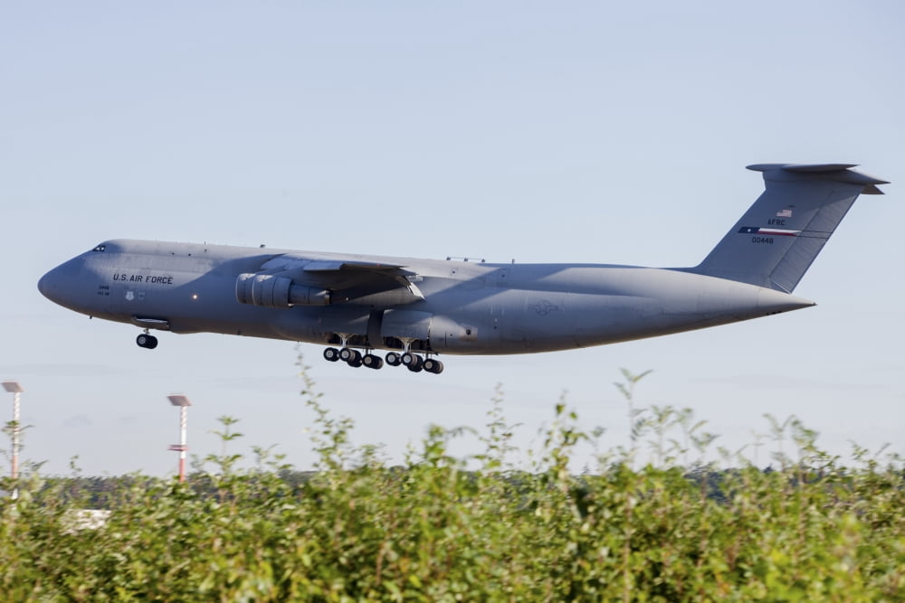 A C-5A Galaxy of the US Air Force Reserve taking off Canvas Art - Timm ZiegenthalerStocktrek Images (34 x 23)
