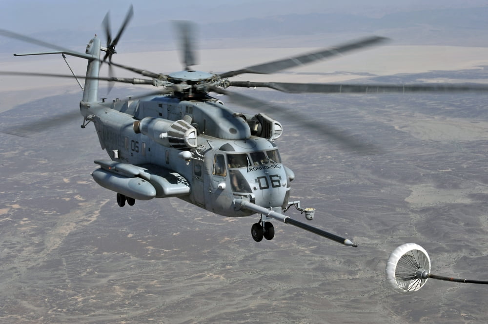A CH-53E Super Stallion approaches a C-130P aircraft to refuel Canvas Art - Stocktrek Images (35 x 24)