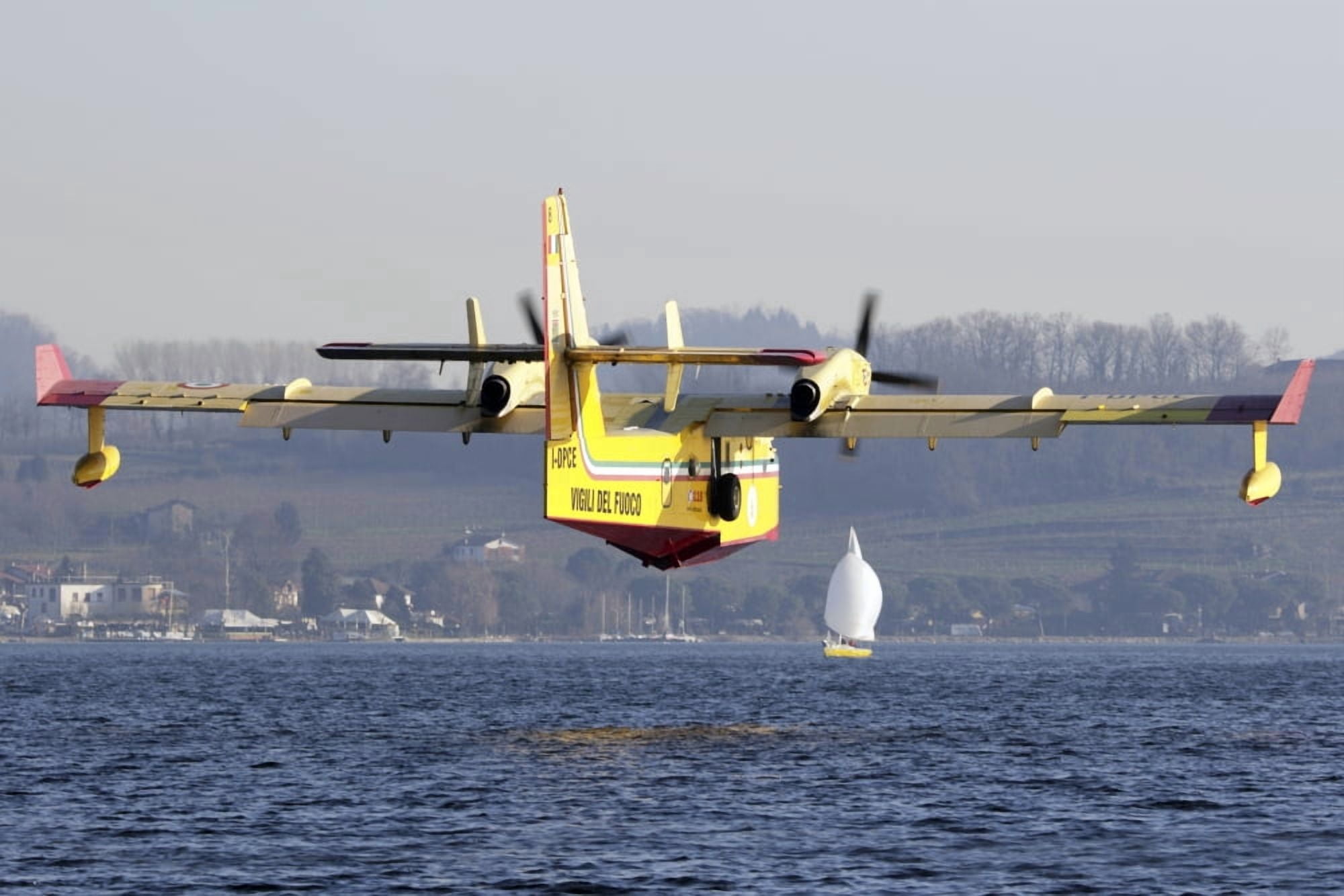A CL-415 Italian Fire Hunter flying above a lake in Italy Canvas Art - Luca NicolottiStocktrek Images (17 x 12)