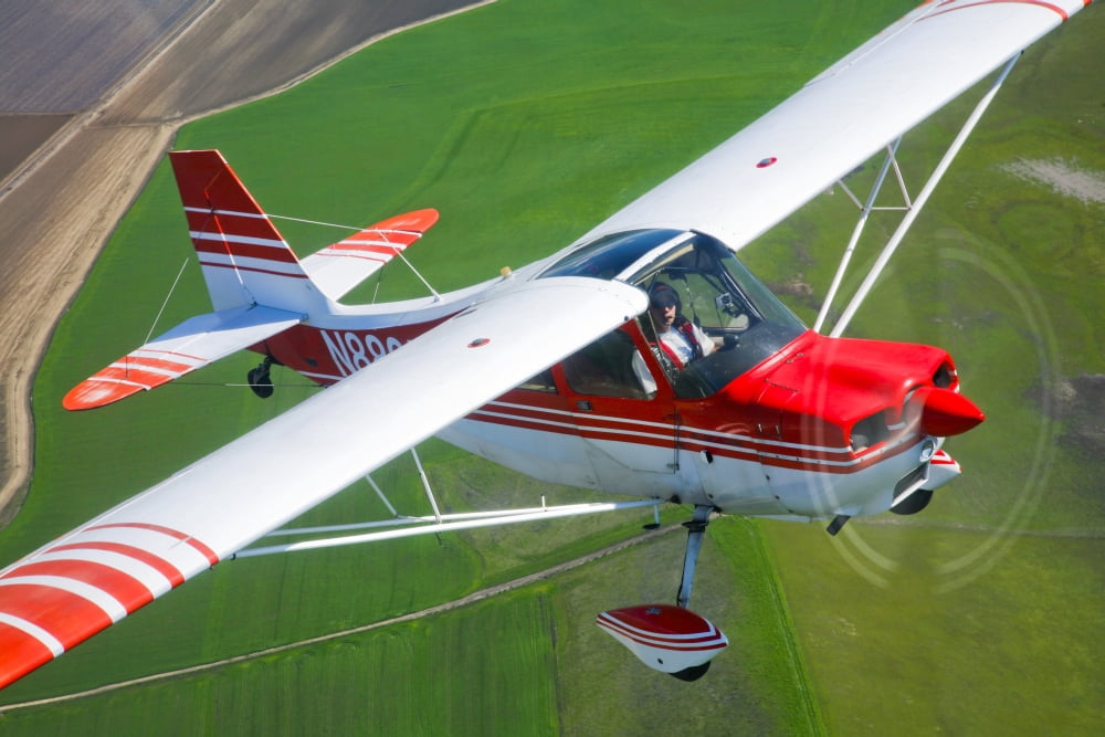 A Champion Aircraft Citabria in flight Canvas Art - Scott GermainStocktrek Images (35 x 23)