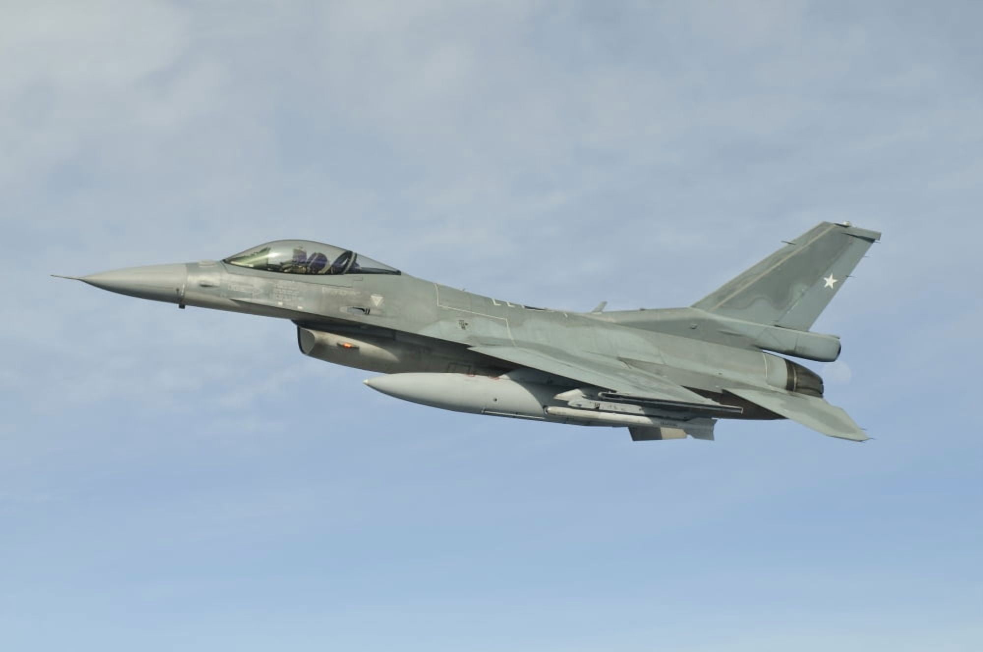 A Chilean Air Force F-16 soars through the sky over Brazil Canvas Art - Giovanni CollaStocktrek Images (35 x 23)