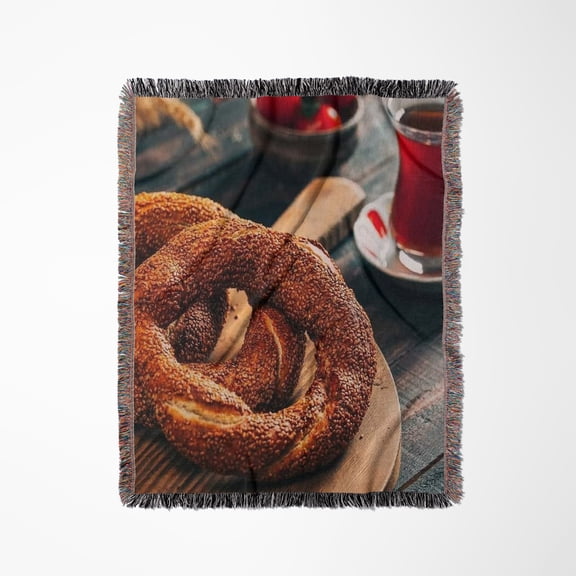 A Close Up Photograph Of A Turkish Simit Bagel And Fresh Tea, Woven Blanket