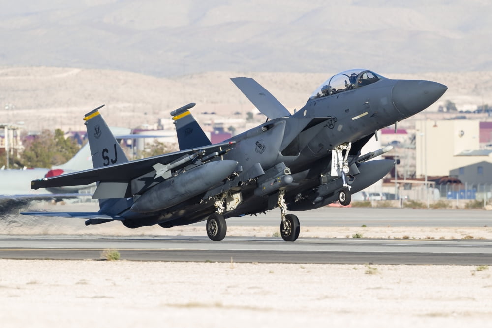 A F-15E Strike Eagle of the US Air Force uses aero braking after landing Canvas Art - Rob EdgcumbeStocktrek Images (17 x 12)