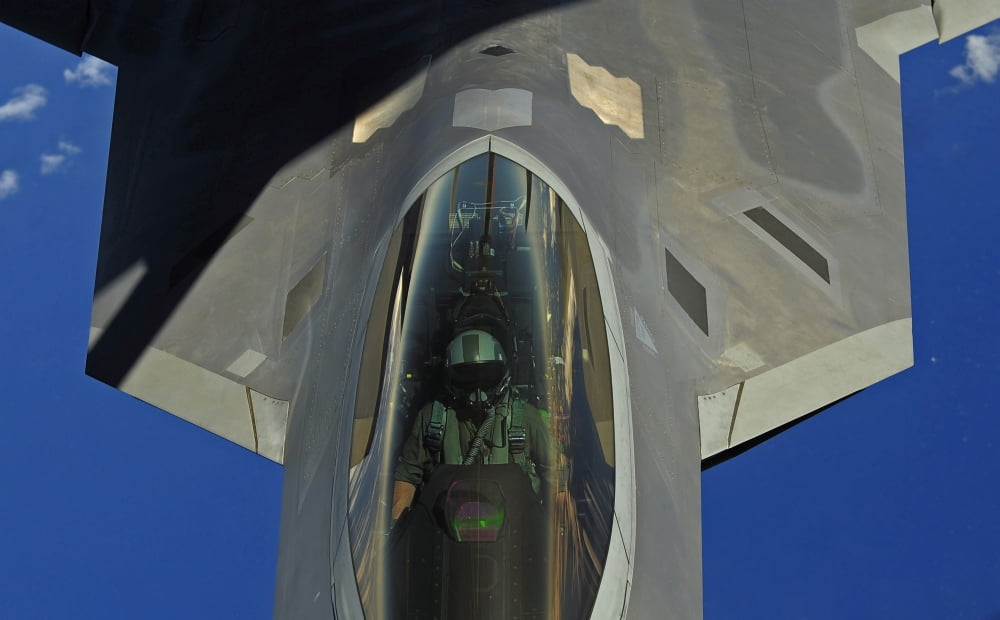 A F-22 Raptor receives fuel from a KC-135 Stratotanker Canvas Art - Stocktrek Images (36 x 22)