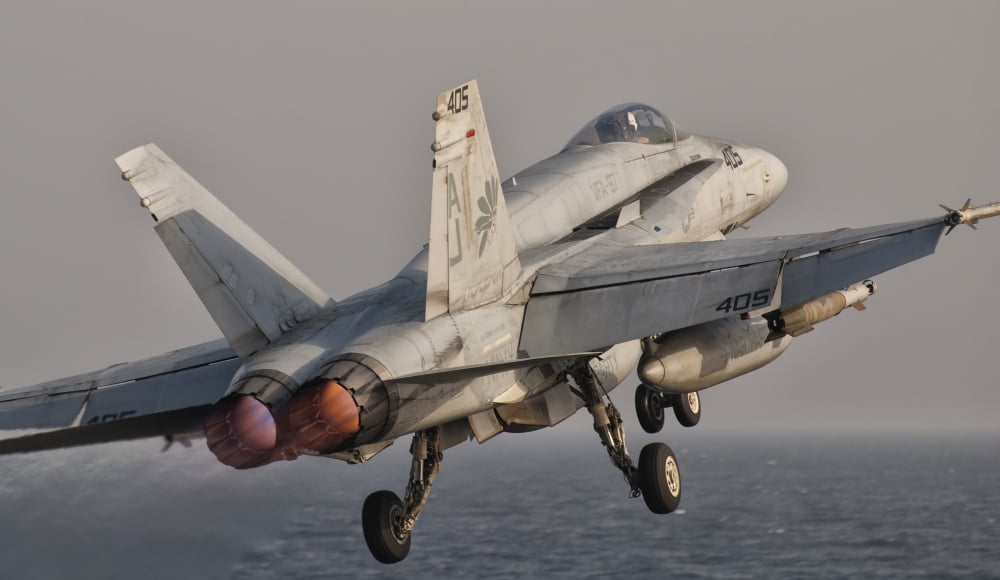 A FA-18C Hornet taking off from USS George HW Bush Canvas Art - Giovanni CollaStocktrek Images (37 x 22)
